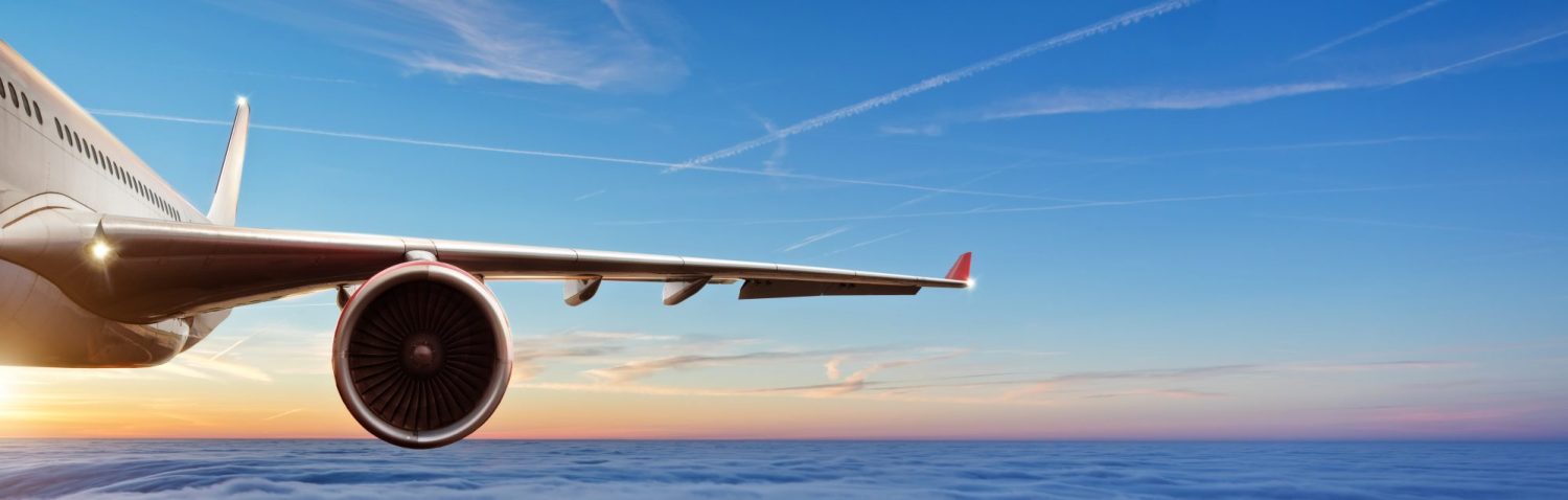 Detail,Of,Wing,Of,Commercial,Airplane,Jetliner,Flying,Above,Clouds